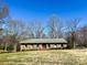 Inviting single-story brick home with tidy landscaping and a classic architectural style at 925 Belmorrow Dr, Charlotte, NC 28214