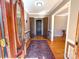 Warm and inviting foyer with hardwood floors, a decorative rug, and view of the interior doors at 925 Belmorrow Dr, Charlotte, NC 28214