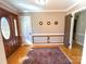 Bright foyer with hardwood floors, a decorative rug, and stylish wall decor at 925 Belmorrow Dr, Charlotte, NC 28214