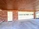 Brick garage with carriage style door and pedestrian door provides covered parking for the home at 925 Belmorrow Dr, Charlotte, NC 28214