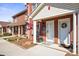 Charming brick townhouse featuring a white door and manicured landscaping at 102 Brandywine Ne Dr # Q4, Conover, NC 28613