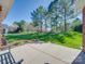 Spacious backyard with patio, perfect for outdoor relaxation and entertaining with tall trees at 108 Avaclaire Way, Indian Trail, NC 28079