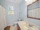 Bathroom featuring a window, vanity, a toilet and shower at 108 Avaclaire Way, Indian Trail, NC 28079