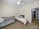 Well lit bedroom featuring carpet, a crib, a daybed and neutral color scheme at 108 Avaclaire Way, Indian Trail, NC 28079