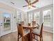 Bright breakfast nook with many windows and access to the backyard for outdoor enjoyment at 108 Avaclaire Way, Indian Trail, NC 28079