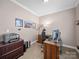 Home office setup with desk, filing cabinet, and carpet flooring at 108 Avaclaire Way, Indian Trail, NC 28079