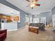 Open living room area with a view to the kitchen, dining room, and entryway at 108 Avaclaire Way, Indian Trail, NC 28079