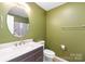 Bathroom featuring a modern vanity, stylish mirror, and a toilet at 111 Harris Farm Rd, Mooresville, NC 28115