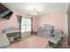 Adorable Bedroom with a gray crib, chandelier, and pink accents at 111 Harris Farm Rd, Mooresville, NC 28115