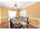 Formal dining room with seating for eight features a golden chandelier and lovely place settings at 111 Harris Farm Rd, Mooresville, NC 28115