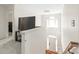 Bright foyer with chandelier, open staircase, and view of the front door at 111 Harris Farm Rd, Mooresville, NC 28115
