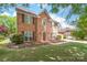 Classic two-story brick home with red shutters and a well-maintained lawn, showcasing a traditional and inviting facade at 111 Harris Farm Rd, Mooresville, NC 28115
