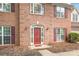 Close up of the home's front entrance with a red door and brick facade at 111 Harris Farm Rd, Mooresville, NC 28115