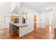 Open kitchen layout with stainless appliances and a breakfast bar with leather counter stools at 111 Harris Farm Rd, Mooresville, NC 28115