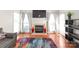 Bright living room featuring a fireplace, large windows and decorative vases at 111 Harris Farm Rd, Mooresville, NC 28115