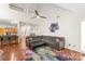 Open living room featuring hardwood floors, vaulted ceilings, and a comfortable sectional sofa at 111 Harris Farm Rd, Mooresville, NC 28115