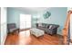 Comfortable living room with hardwood floors, stylish furniture, and plenty of natural light at 111 Harris Farm Rd, Mooresville, NC 28115