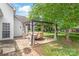 Charming backyard patio shaded by a pergola, perfect for outdoor dining at 111 Harris Farm Rd, Mooresville, NC 28115