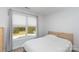 Neat bedroom with window view, simple bed frame, and plush gray carpeting at 1120 Millwright Ln, Matthews, NC 28104