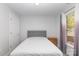 Cozy bedroom with sleek modern decor, large window, and neutral gray tones at 1120 Millwright Ln, Matthews, NC 28104