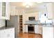 Modern kitchen with stainless steel appliances, granite countertops, and ample cabinet space at 1120 Millwright Ln, Matthews, NC 28104
