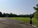 Wide open green soccer field with pet waste station, enhancing the outdoor experience for residents and their furry friends at 1120 Millwright Ln, Matthews, NC 28104