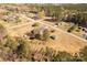 An aerial view showcases the homes and sheds on the large grassy property at 1139 Suttle Rd, Lancaster, SC 29720