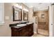 Bathroom featuring double sinks with dark countertops and a walk-in shower at 1139 Suttle Rd, Lancaster, SC 29720