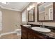 Bathroom featuring double sinks with dark countertops and tile flooring at 1139 Suttle Rd, Lancaster, SC 29720