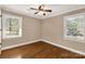 Bedroom with hardwood floors, a ceiling fan, and natural light from large windows at 1139 Suttle Rd, Lancaster, SC 29720