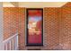 Close-up of the red front door, showcasing the brick facade and covered porch at 1139 Suttle Rd, Lancaster, SC 29720