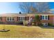 Charming brick home with a welcoming front porch, showcasing its classic appeal at 1139 Suttle Rd, Lancaster, SC 29720