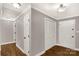 Hallway with hardwood floors, closet space, neutral walls, and decorative lighting at 1139 Suttle Rd, Lancaster, SC 29720