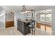 Kitchen featuring an island with bar stool seating, white cabinets, and easy access to the living spaces at 1139 Suttle Rd, Lancaster, SC 29720