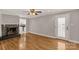 Inviting living room with a decorative fireplace, hardwood floors, and access to the kitchen at 1139 Suttle Rd, Lancaster, SC 29720