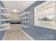 Mud room featuring built-in shelves, storage cabinets, and a window for natural light at 1139 Suttle Rd, Lancaster, SC 29720