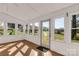 Enclosed sunroom area with windows and tile flooring at 1139 Suttle Rd, Lancaster, SC 29720