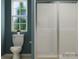 Bathroom featuring a toilet and a modern glass-enclosed shower with natural light at 1192 Blackburn Cir, Edgemoor, SC 29712