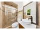 Elegant bathroom featuring a vessel sink, and a tiled shower with glass door at 1316 Fox Run Dr, Charlotte, NC 28212