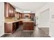 Spacious kitchen featuring stainless steel appliances, dark cabinets, and an island at 1316 Fox Run Dr, Charlotte, NC 28212