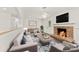Inviting living room featuring a stone fireplace, a modern couch, and stylish decor at 1316 Fox Run Dr, Charlotte, NC 28212
