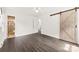 Inviting main bedroom with sliding barn door leading to ensuite bath at 1316 Fox Run Dr, Charlotte, NC 28212