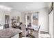 Bright dining room with large windows, wood floors, and a dining table with seating at 1435 Mammoth Rd, Hickory, NC 28602