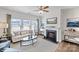 Cozy living room featuring a fireplace, large windows with natural light, and modern decor at 1435 Mammoth Rd, Hickory, NC 28602