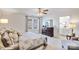 A bedroom featuring a large window, ceiling fan, dresser, and an ensuite bathroom at 1435 Mammoth Rd, Hickory, NC 28602