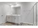 Bathroom featuring double sinks, a large mirror and walk-in shower with glass doors at 1439 Mammoth Rd, Hickory, NC 28602