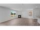 Cozy living room featuring a fireplace and large windows, providing ample natural light at 1439 Mammoth Rd, Hickory, NC 28602