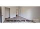 Bedroom featuring carpeted floors, white walls, and closet at 1501 School Ave, Gastonia, NC 28052