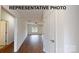 Bright living room with wood flooring and a window offering ample natural light at 1501 School Ave, Gastonia, NC 28052