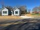 Charming blue house with black shutters on a sunny day at 1501 School Ave, Gastonia, NC 28052